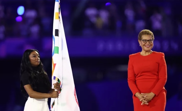 Simone Biles Conveys the Olympic Banner During Paris Shutting Service as Olympics Change to Los Angeles.